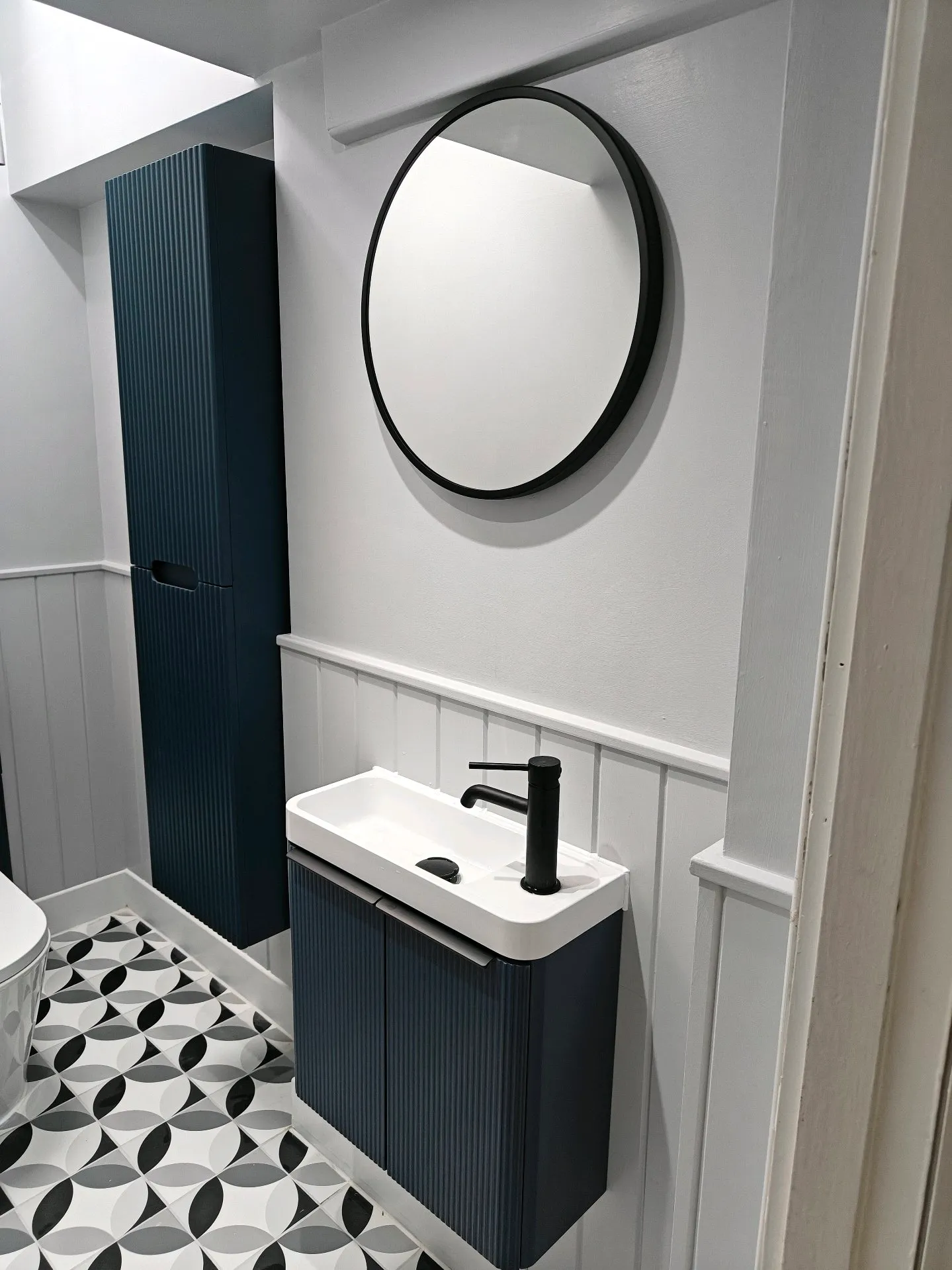 After: Finished cloakroom in Kent with stylish vanity, patterned floor tiles and panelling